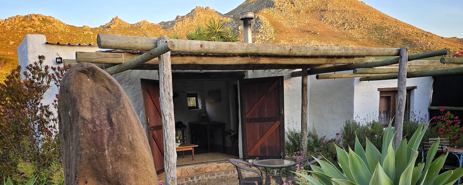 Red Rock farm cottage with background mountains
