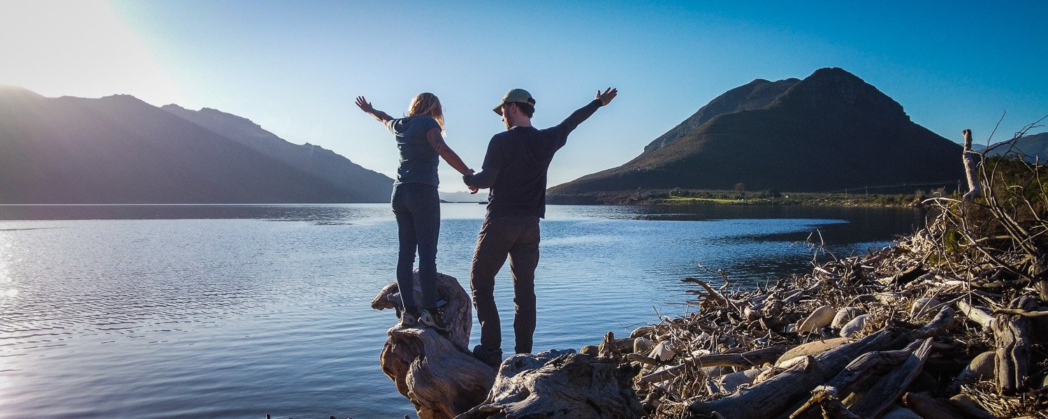 Two hikers enjoying the dam view