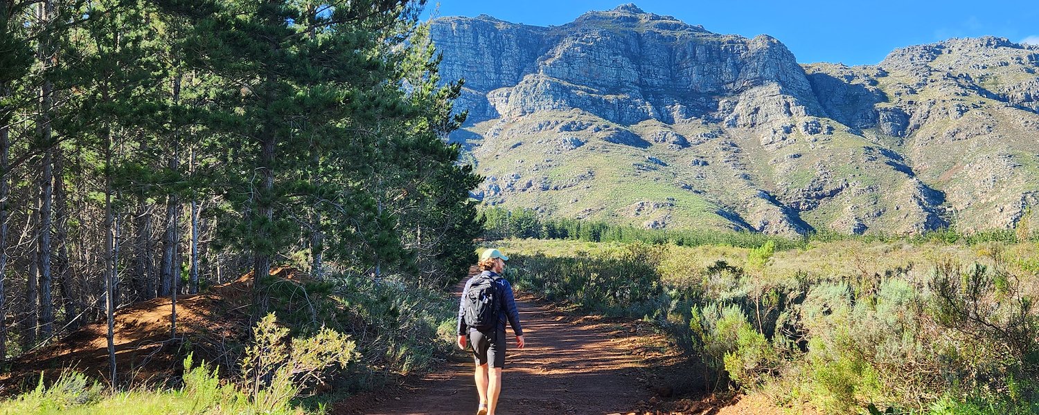 Man hiking up to the Waterfall  