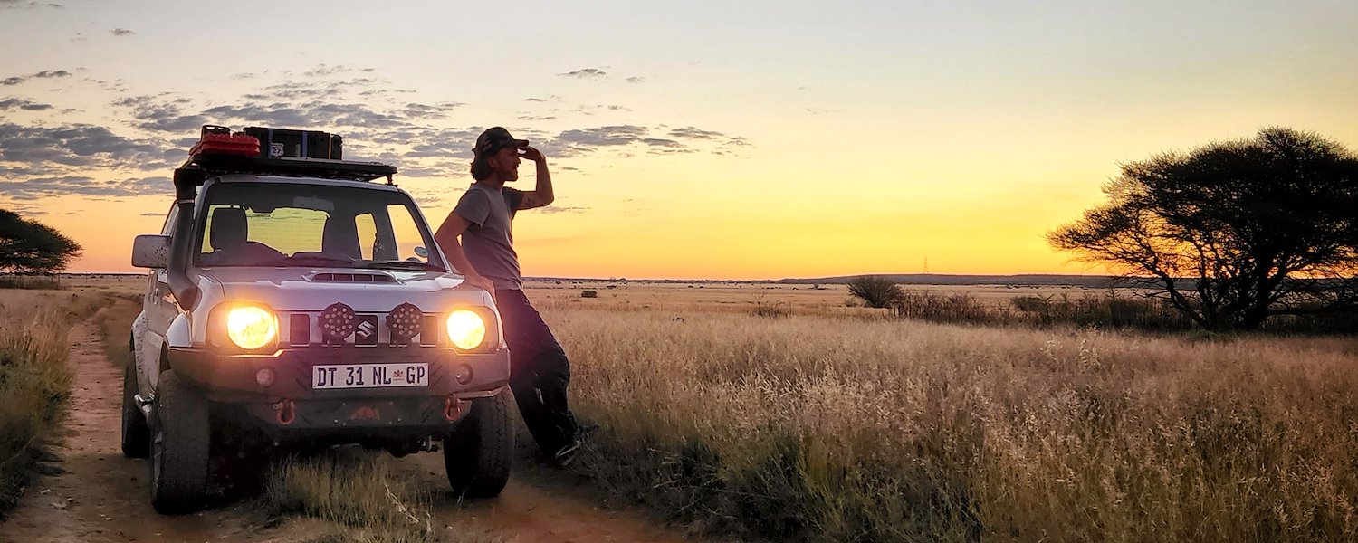 Enjoying the late afternoon sunset while leaning on vehicle