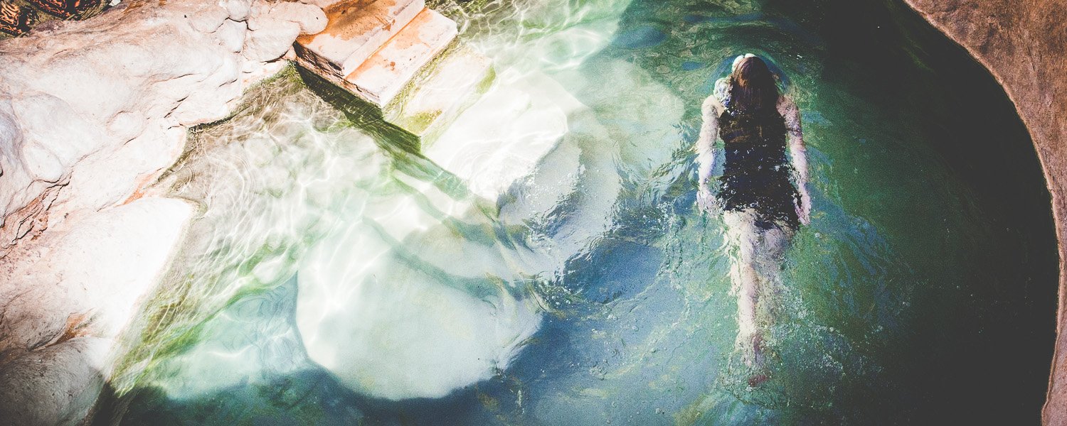 Woman swimming in hot spring at Riemvasmaak