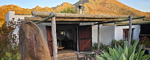 Red Rock farm cottage with background mountains
